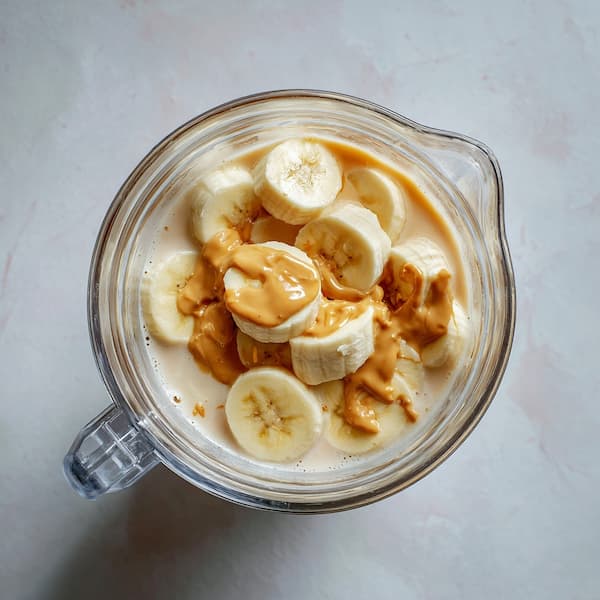 banana peanut butter smoothie in a blender